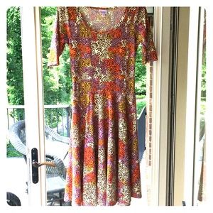 LuLaRoe purple, cream, orange, and yellow dress.